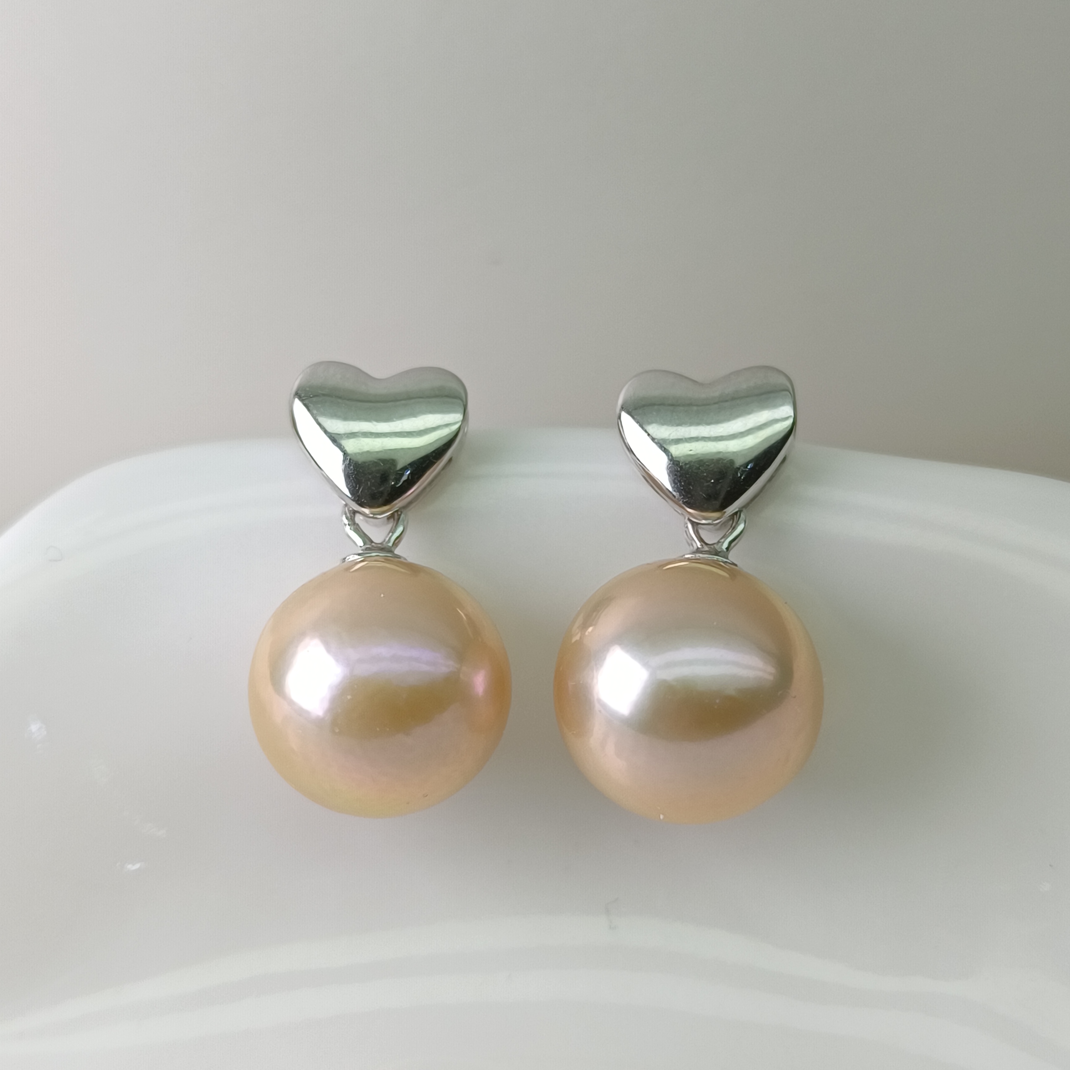 【瑞米珍珠】淡水爱迪生橘色珠爱心S925银耳钉10-11mm