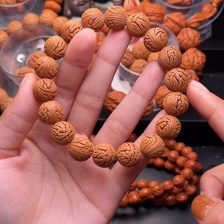 手***8手串桃核绣球手串1.4