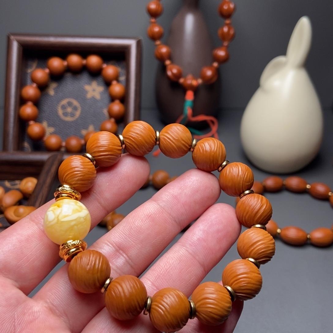 羊***拉橄榄核手串/手链金标