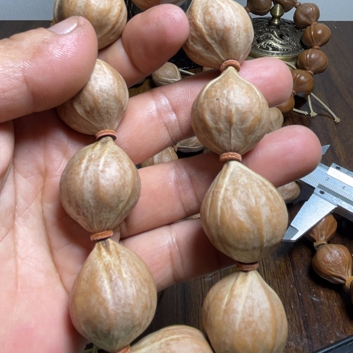 杨***吖橄榄核吊坠橄榄核手串