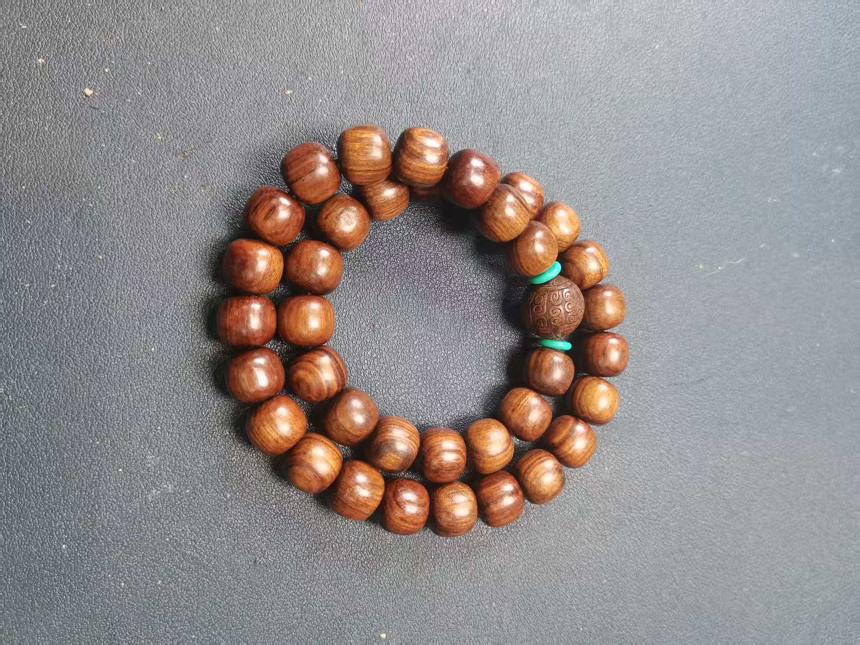 A652黑油桃木卡1.2手持双圈手串