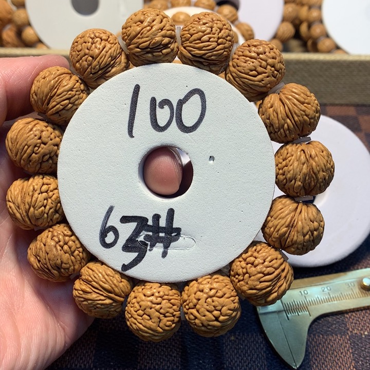 桃核手串尚****业63号链接，