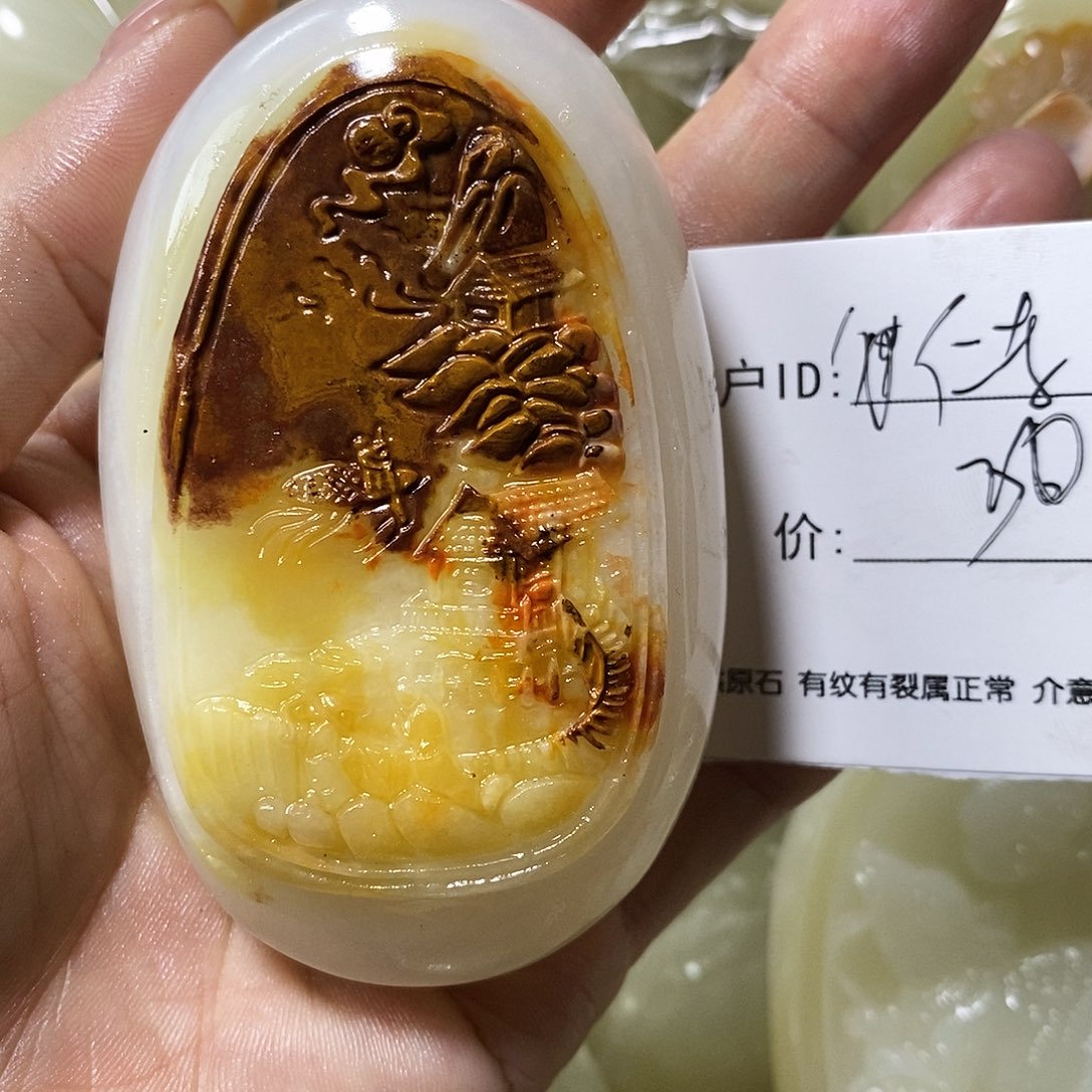 石材仁****军古青石手把件