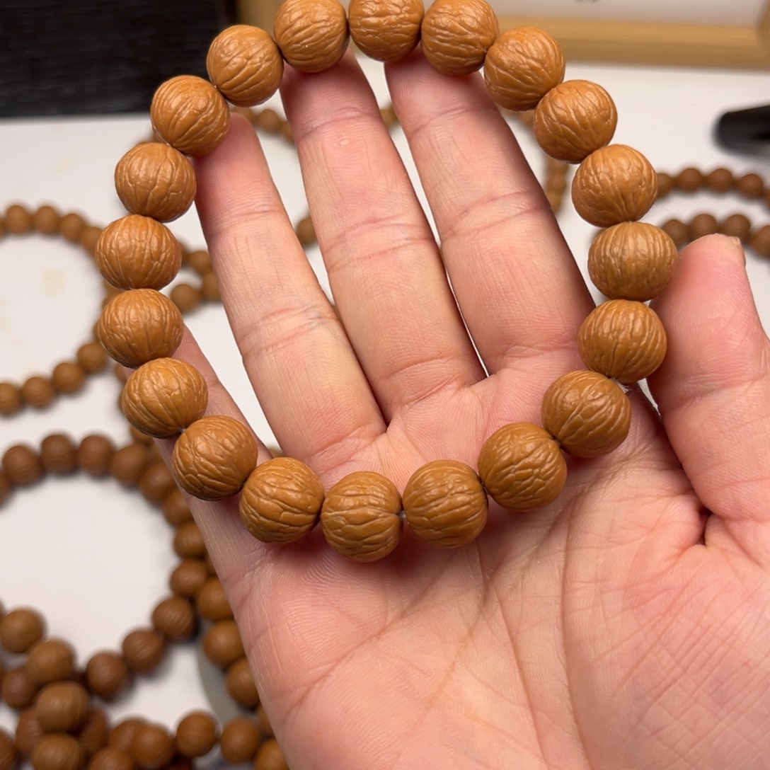 庆***猴头核桃吊坠凤羽