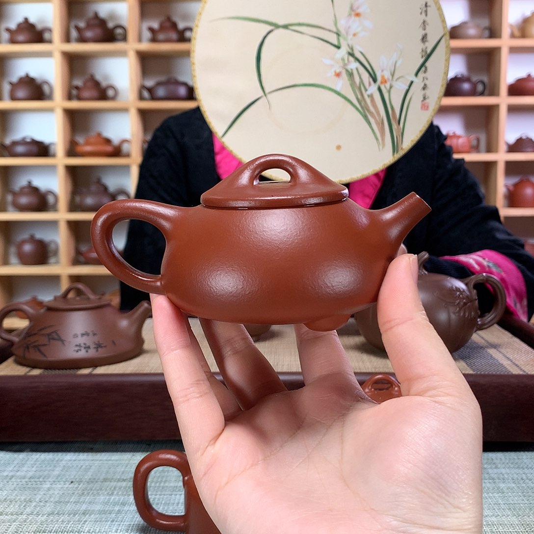 紫砂茶壶俗***巴紫砂壶手工制作