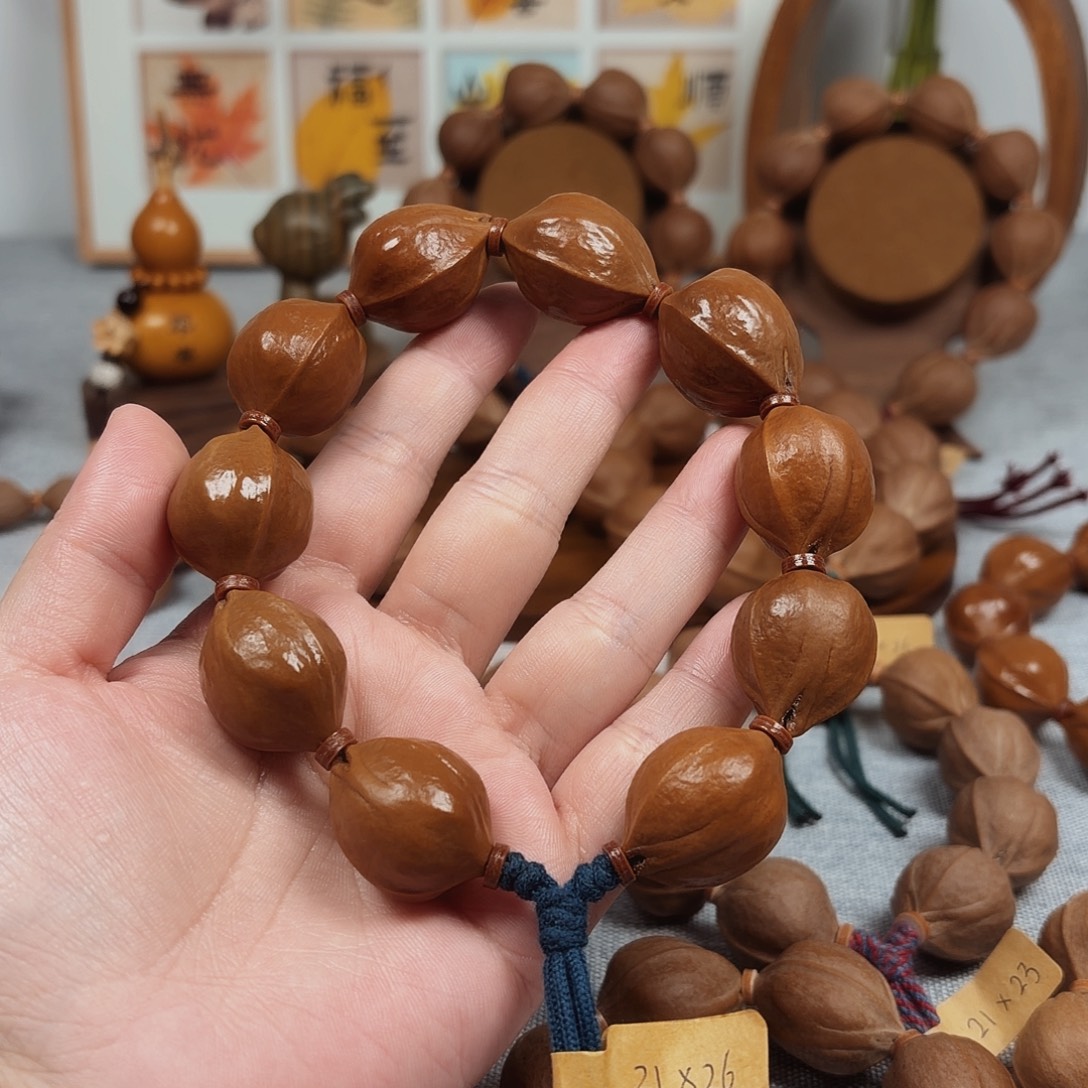 疆***馫橄榄核手串梅林铁核21.26橄榄核