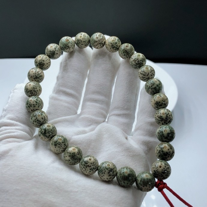 星月菩提海南原生态石玉料正圆珠型手持11mm盘玩易变色