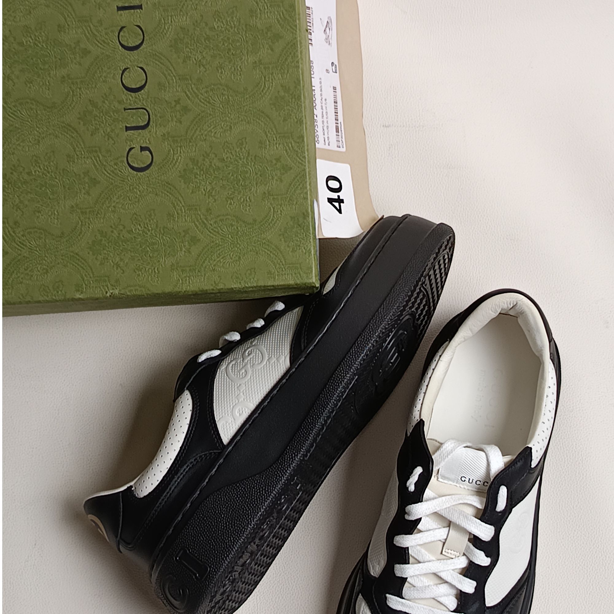 99新 GUCCI/古驰 奢品板鞋 男女同款黑白拼色饼干鞋 正品未使用