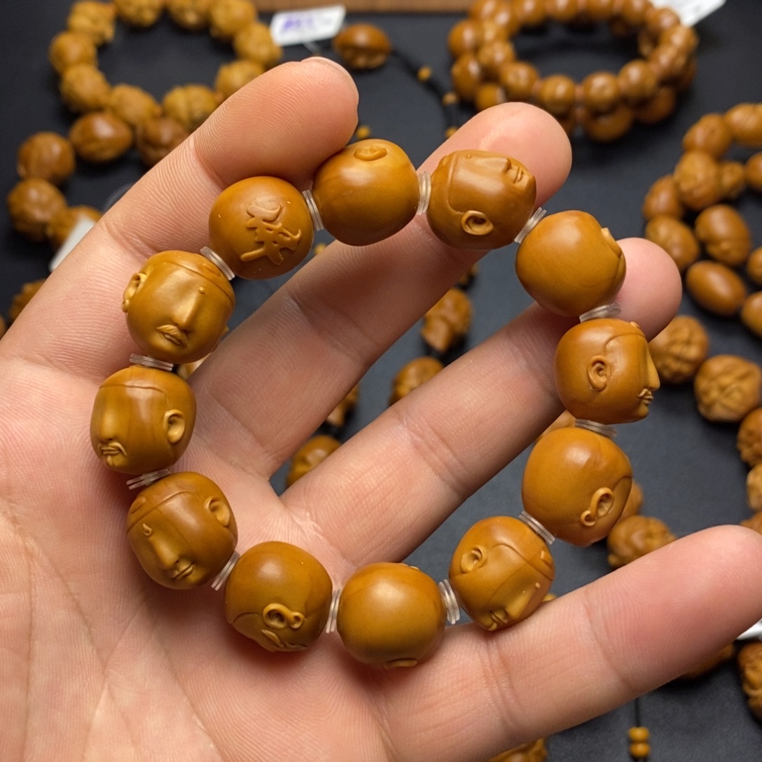 ঞ***王橄榄核手串/手链老型无相佛