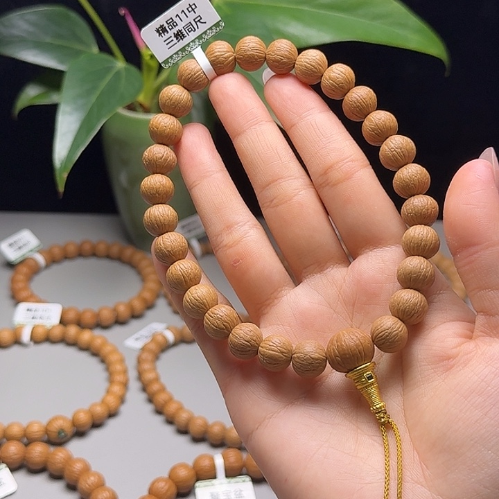兰***店吊坠猴头核桃凤羽
