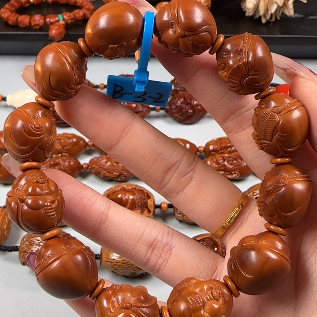 橄榄核手串/手链凯尺寸1.65鸡血红油核弥勒手串