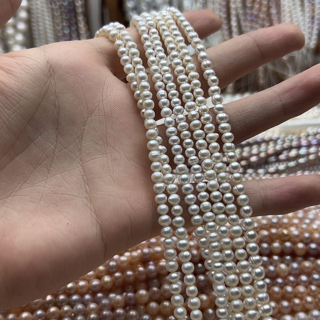 伊***呀半成品淡水珍珠未镶嵌4.5螺纹近圆极光