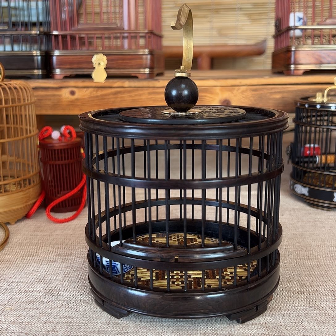 冬***雪榫卯拼接，乌木紫光檀圆笼一个