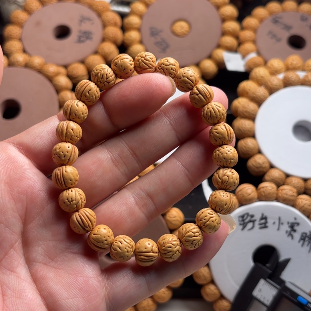 萬***缰菩提籽类桃核麦穗金品手串