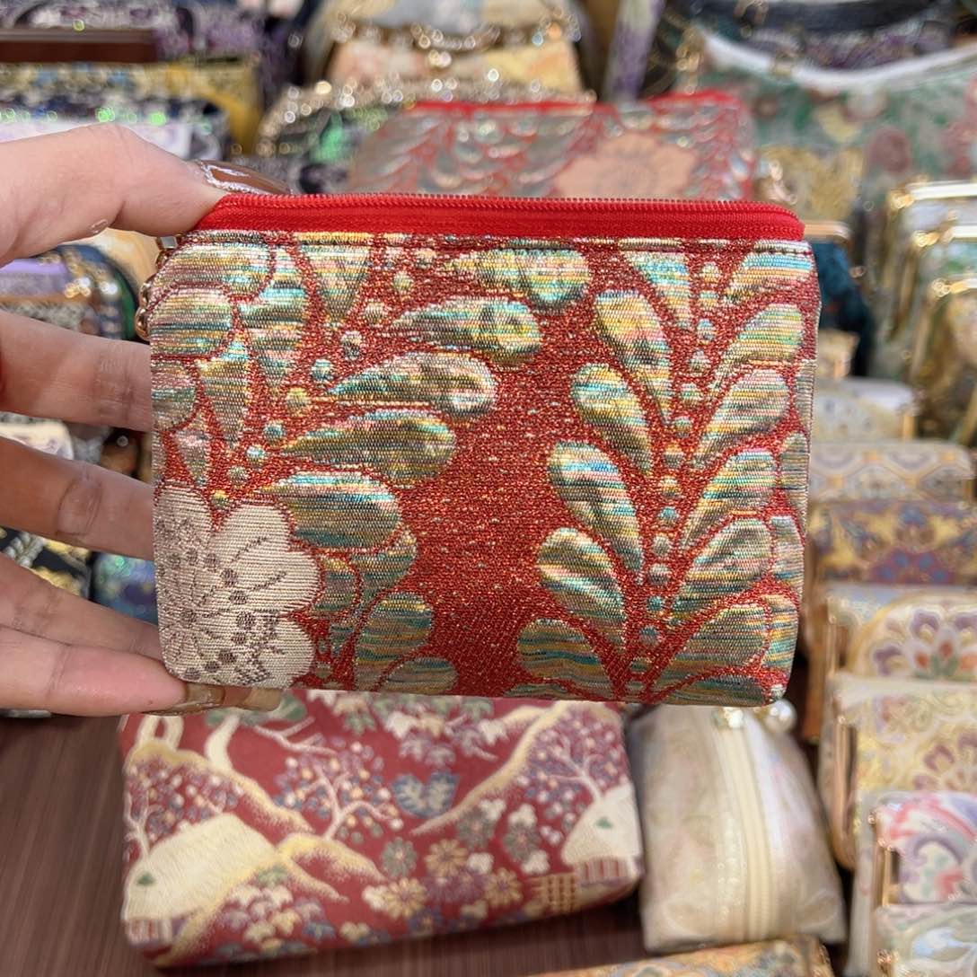 星***a蚕丝彩金拉链零钱包