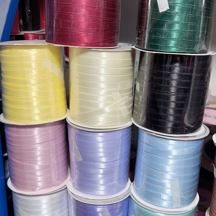 0.6的高亮缎带黑色浅粉浅蓝各50码