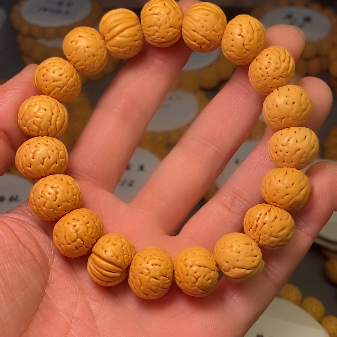 旭***升桃核吊坠精品桃花手串金丹