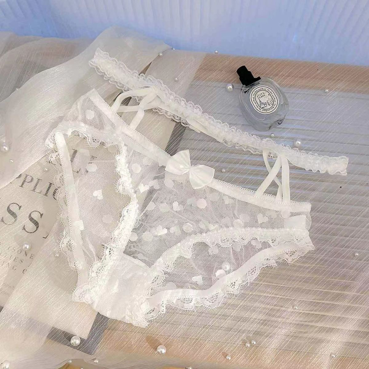 性感露腰女郎蕾丝情调纯欲高颜值蝴蝶结火辣透明大包臀挂腰三角裤