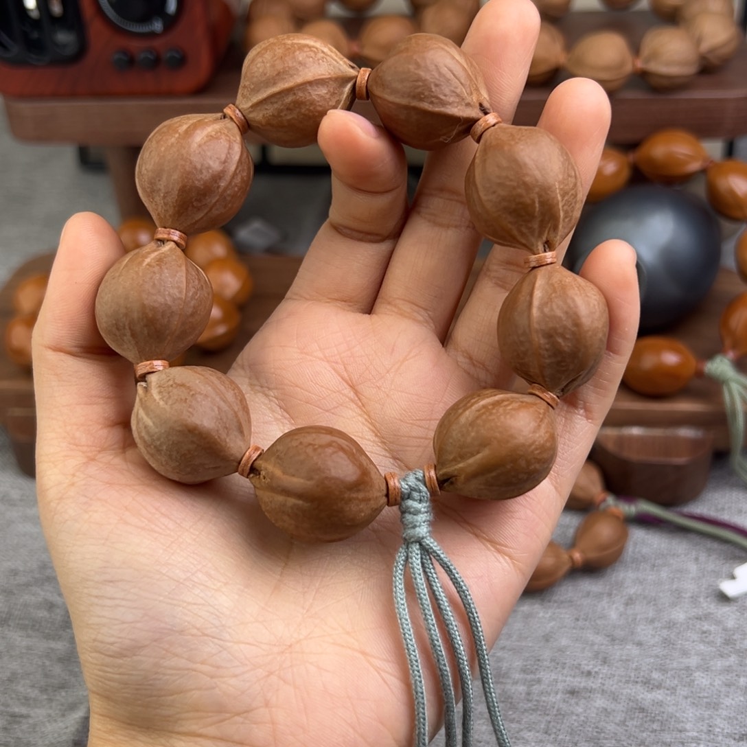 淘***湿橄榄核手串 三花铁核梅林手串
