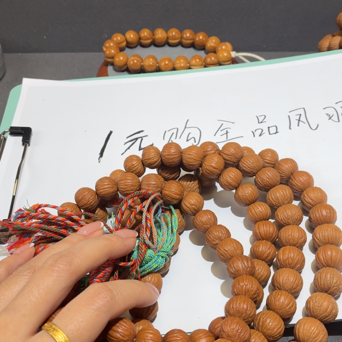 桃核吊坠全品凤羽手持