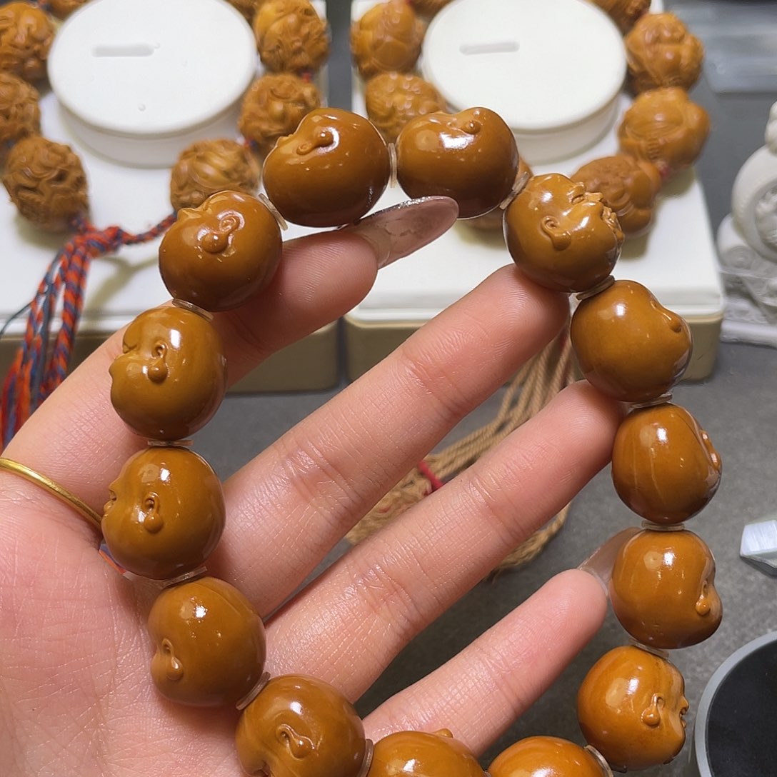 橘***子橄榄核吊坠橄榄核雕