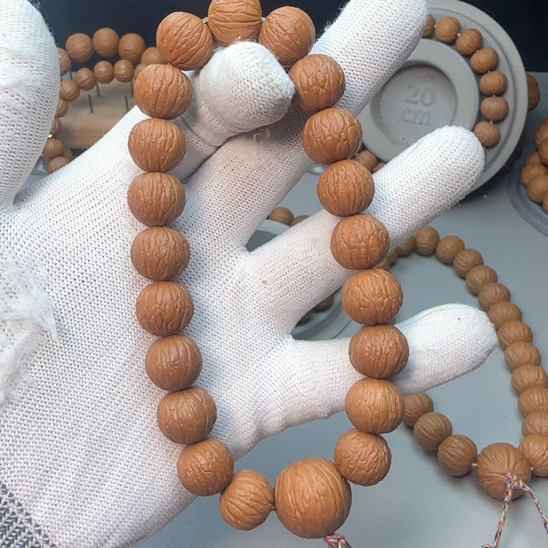 猴头核桃手串凤羽手持