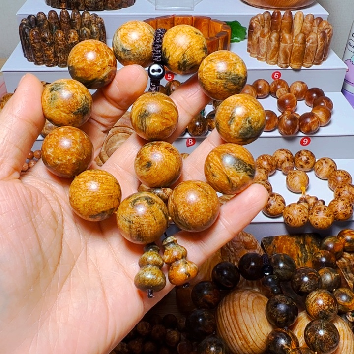 亿***业木质非金属琥珀木高品龙鳞手串