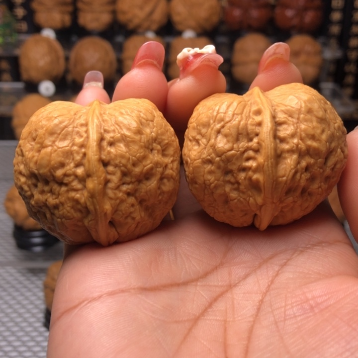 橄榄核把件2峭壁元宝