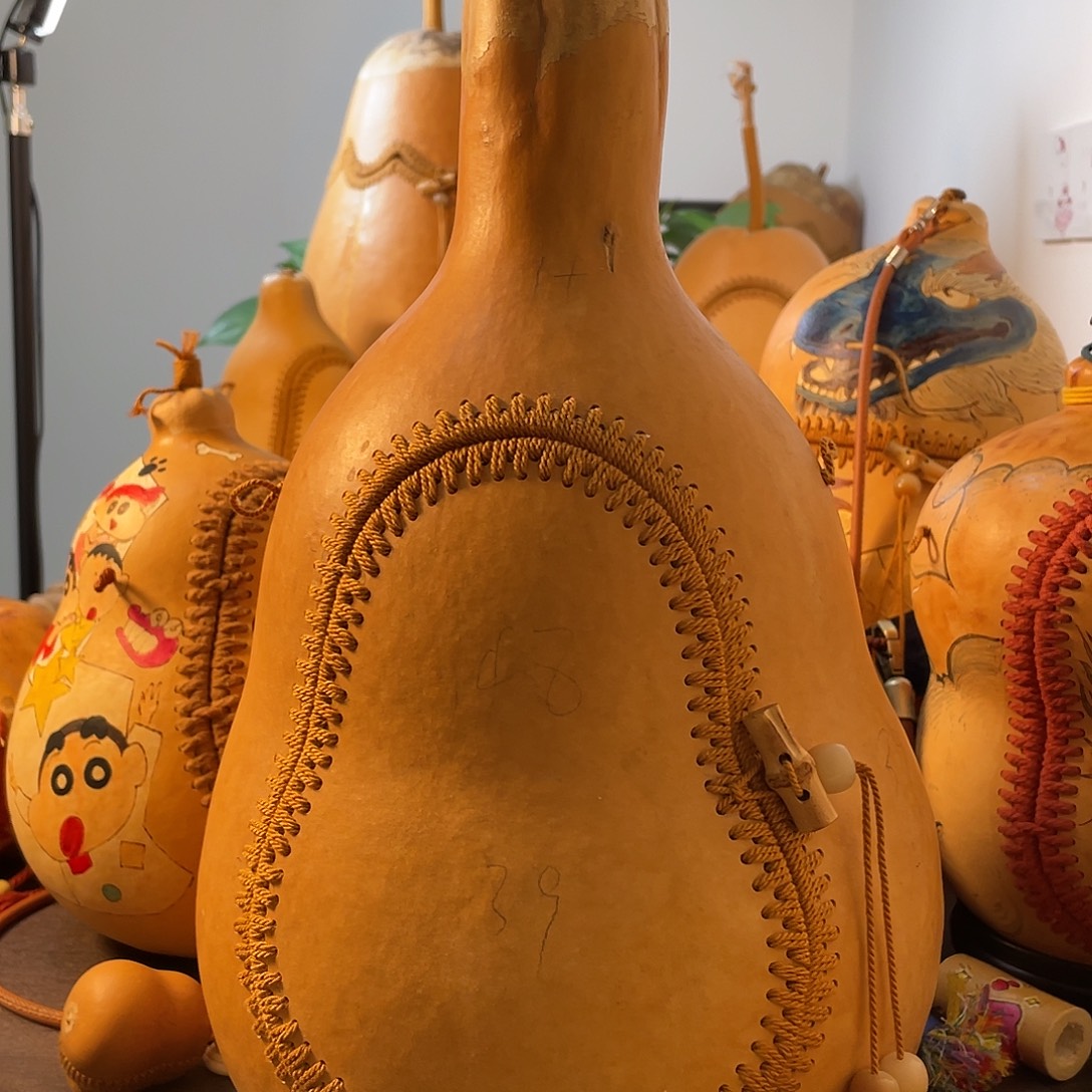 菰***米福利侧开葫芦包包