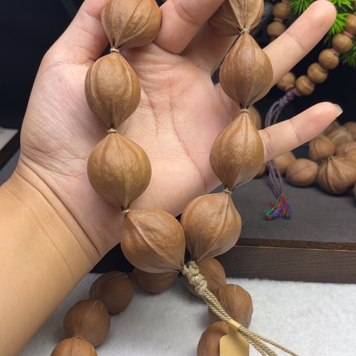 东***哥橄榄核手串/手链2.5*3.0四花铁核