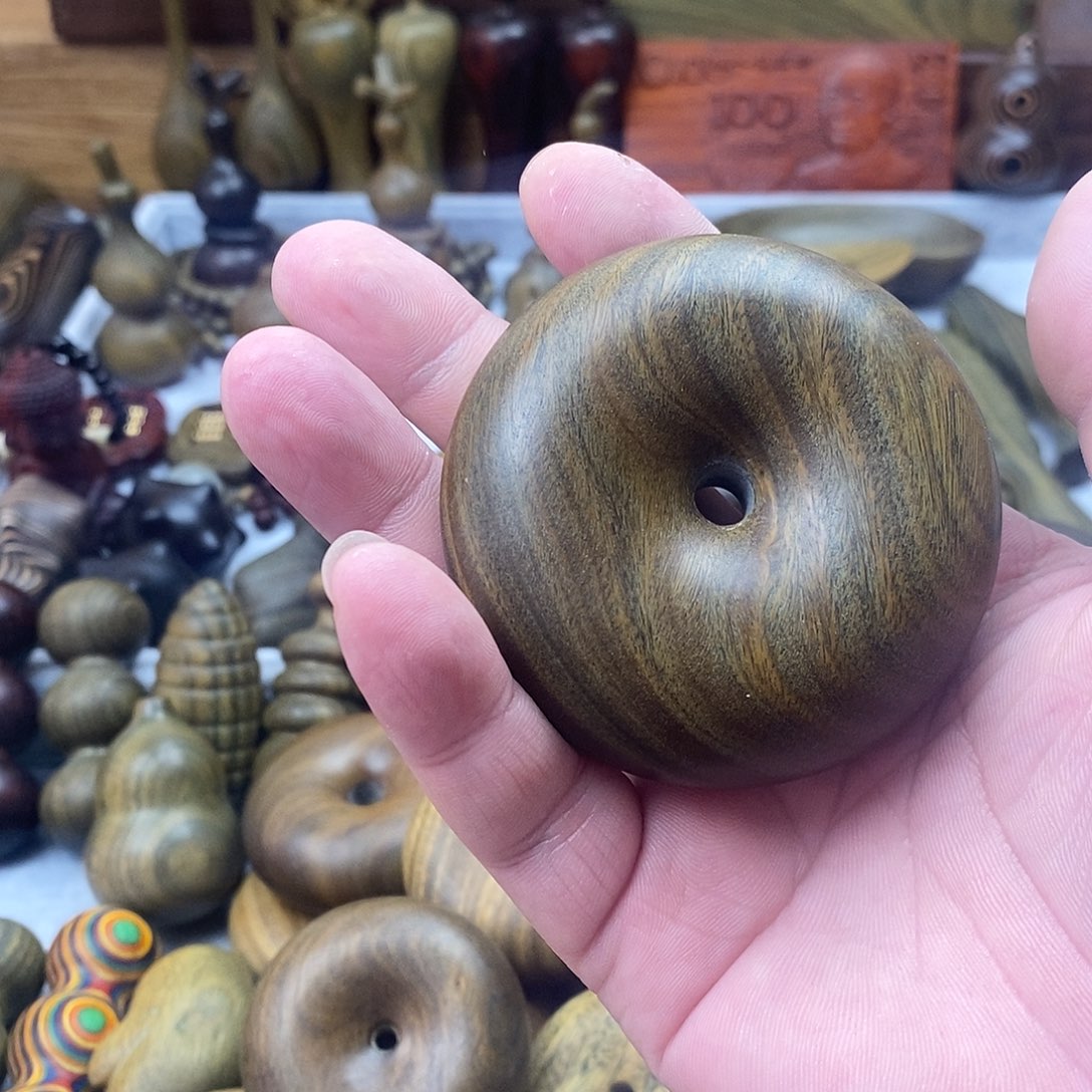 任***行香榧木阿根廷绿檀手把件