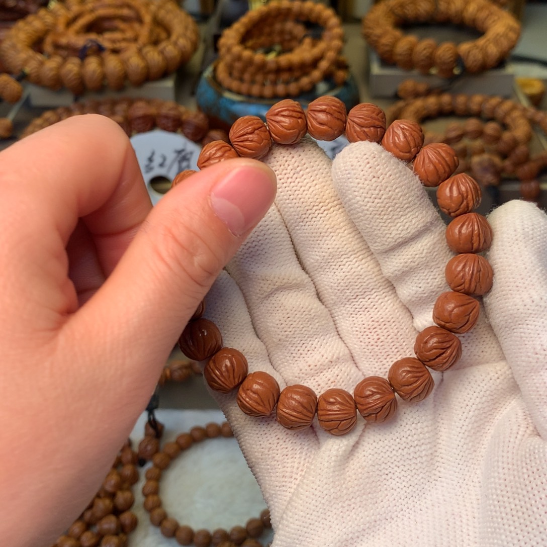 转***来桃核手串秦岭龙纹