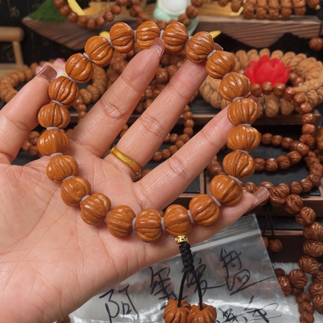 桃核手串阿***?16野生籽佛手手持