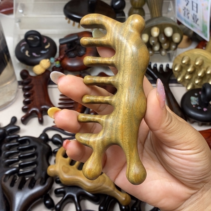 绿檀蜗牛按摩梳子