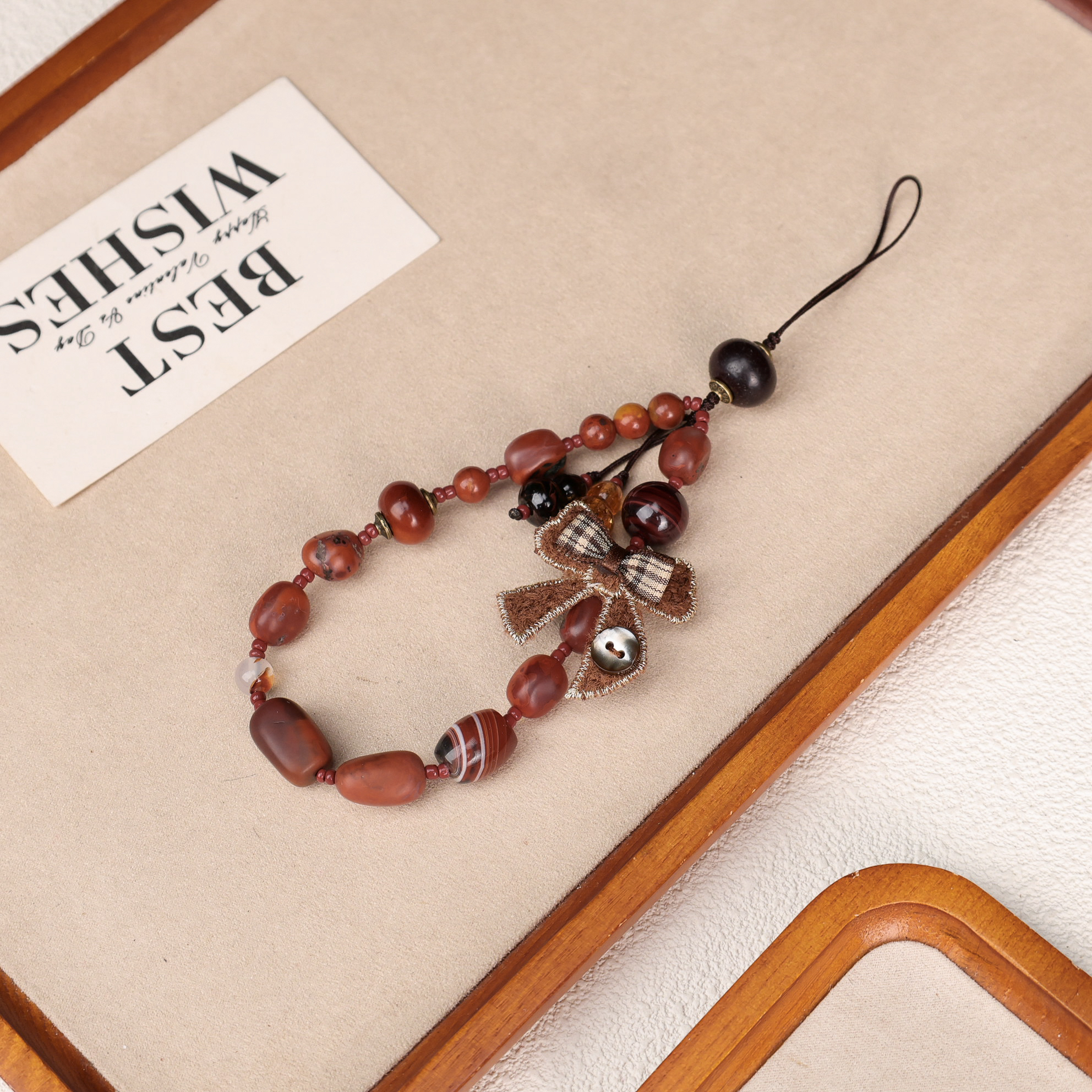 南红随型包浆缠丝蝴蝶结手机链LZ4720