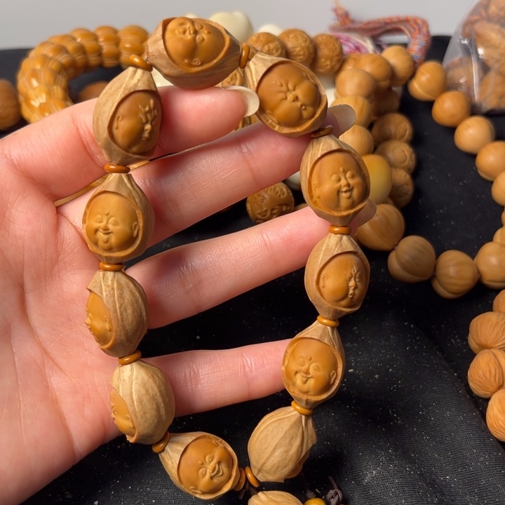 橄榄核吊坠包衣百态