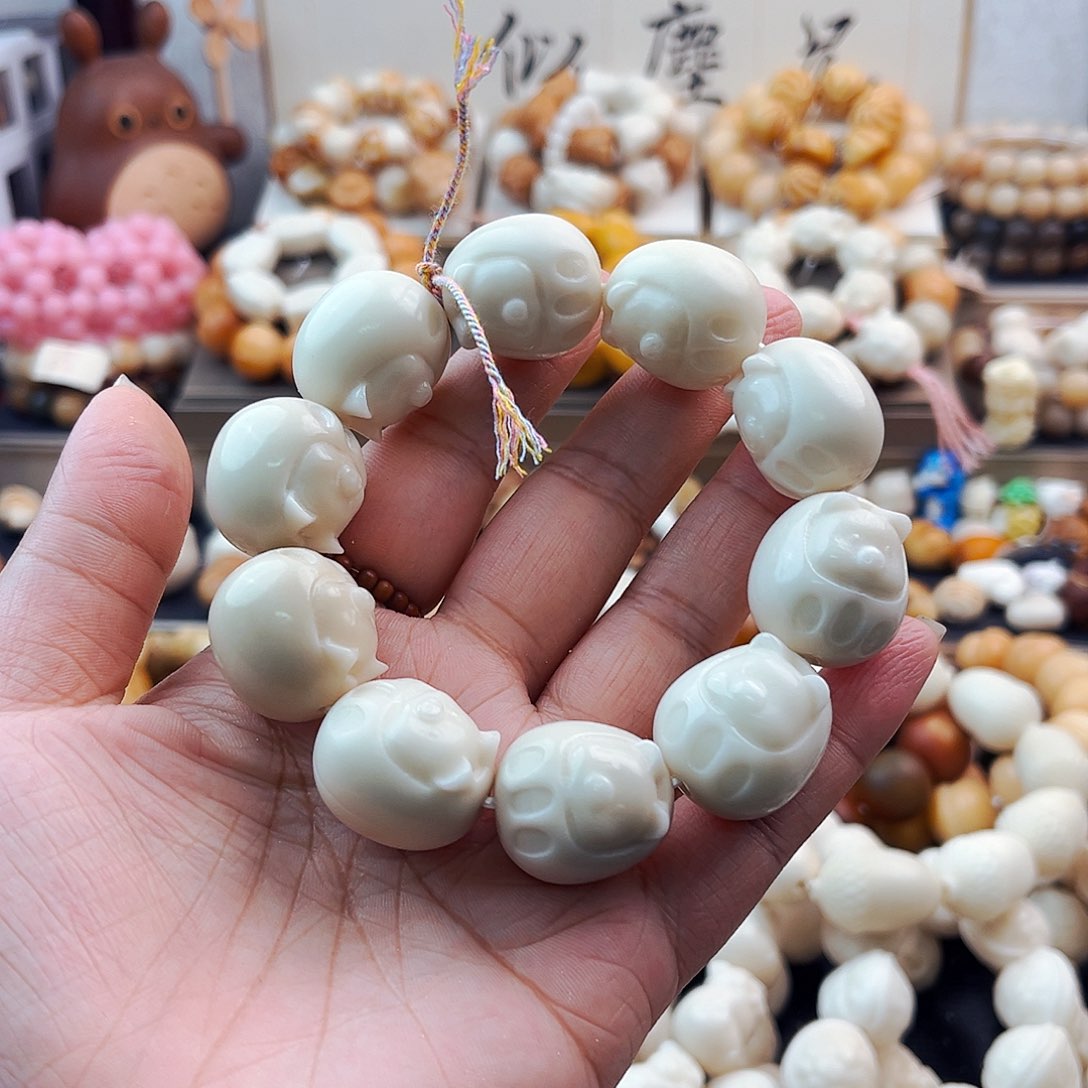 菩提根/象牙果手串达摩猪微瑕七折