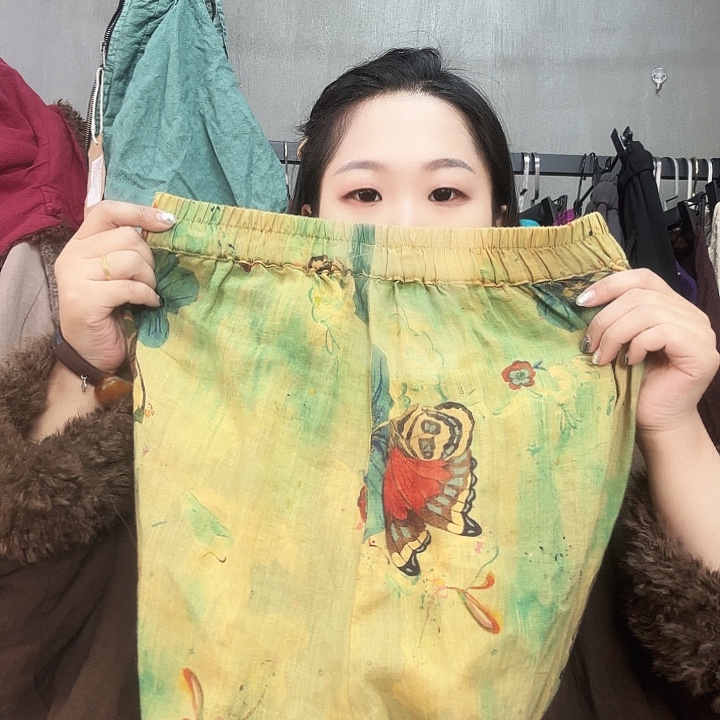 禾***生黄绿蝴蝶裤子不退换