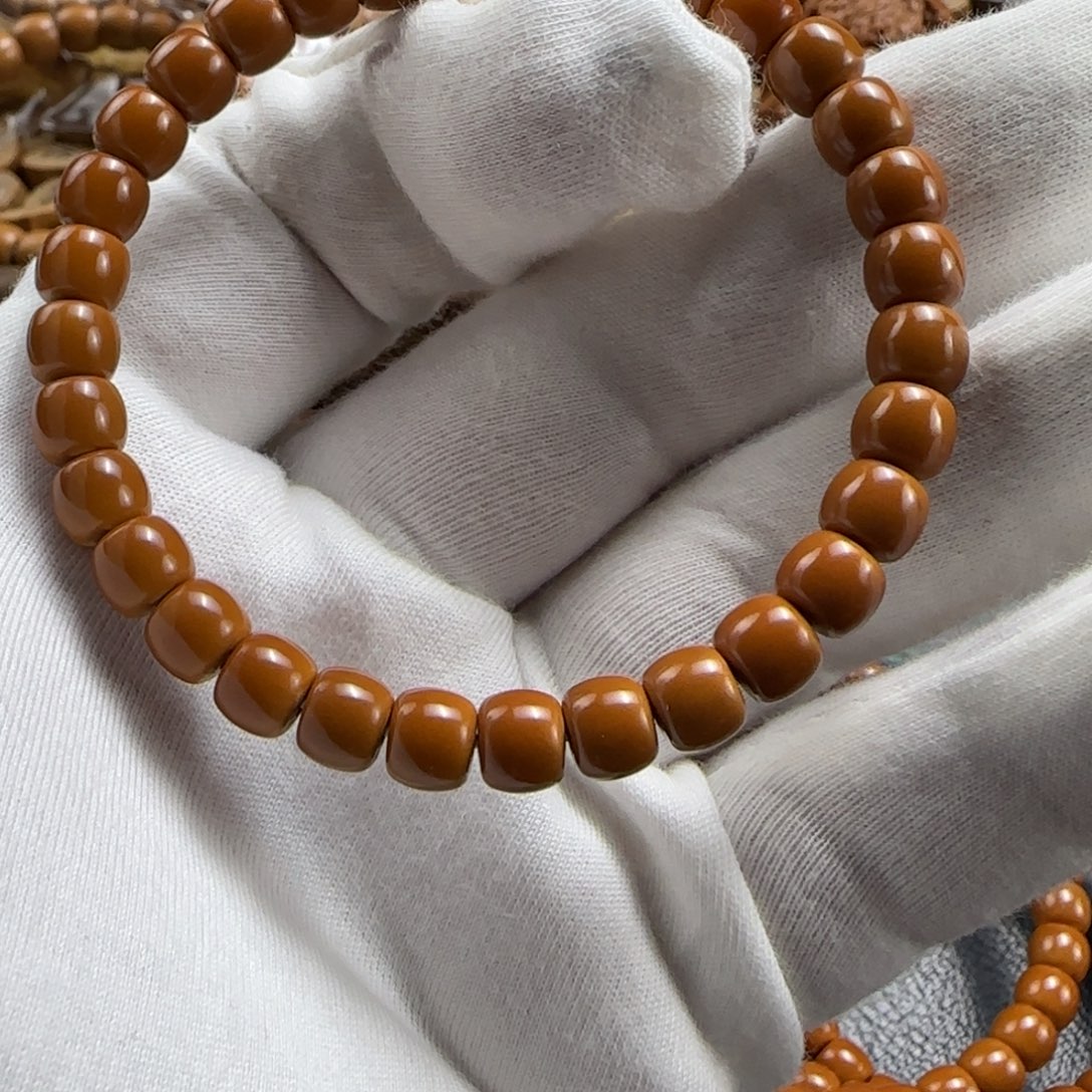 月***落手串橄榄核老挝核尖单圈7.0mm三花爆红