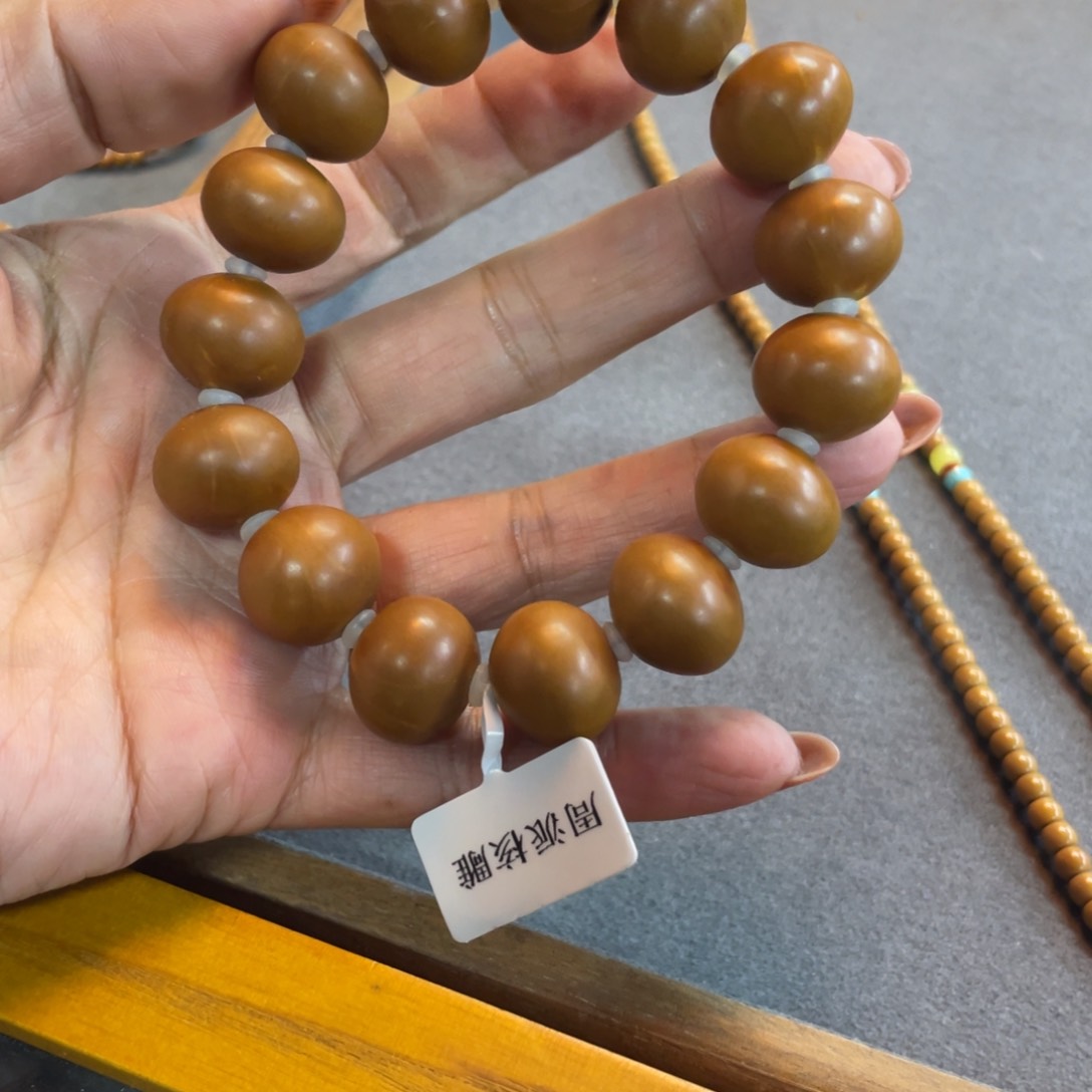 橄榄核手串仅一条算盘珠子
