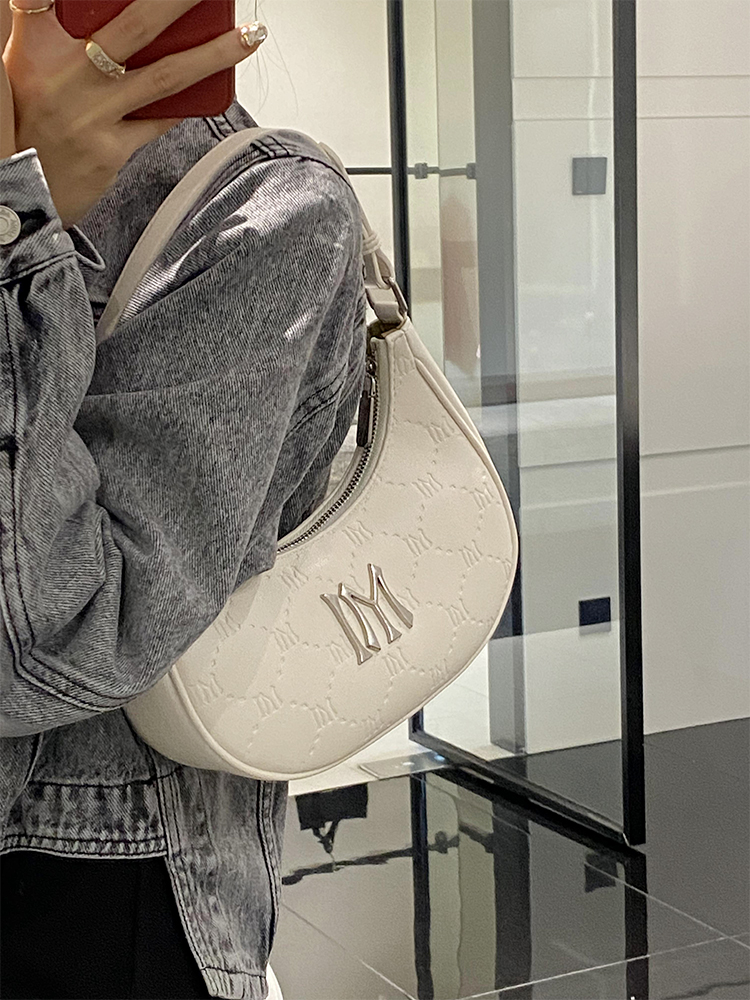 单肩月牙腋下包法棍包包2025新款高级感小众白色手提包月亮饺子包