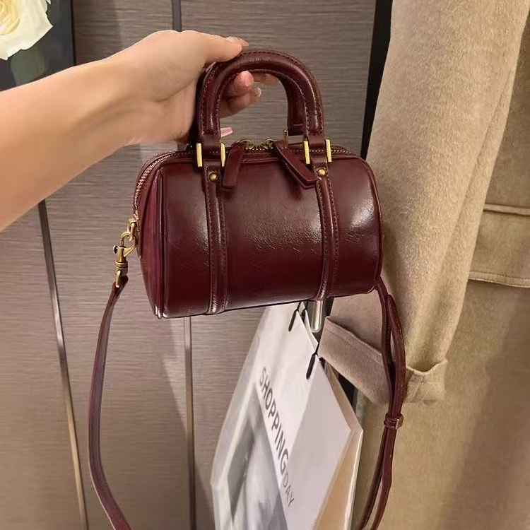 高级感复古软皮枕头包包女2025新款百搭小众轻奢圆筒包手提斜挎包