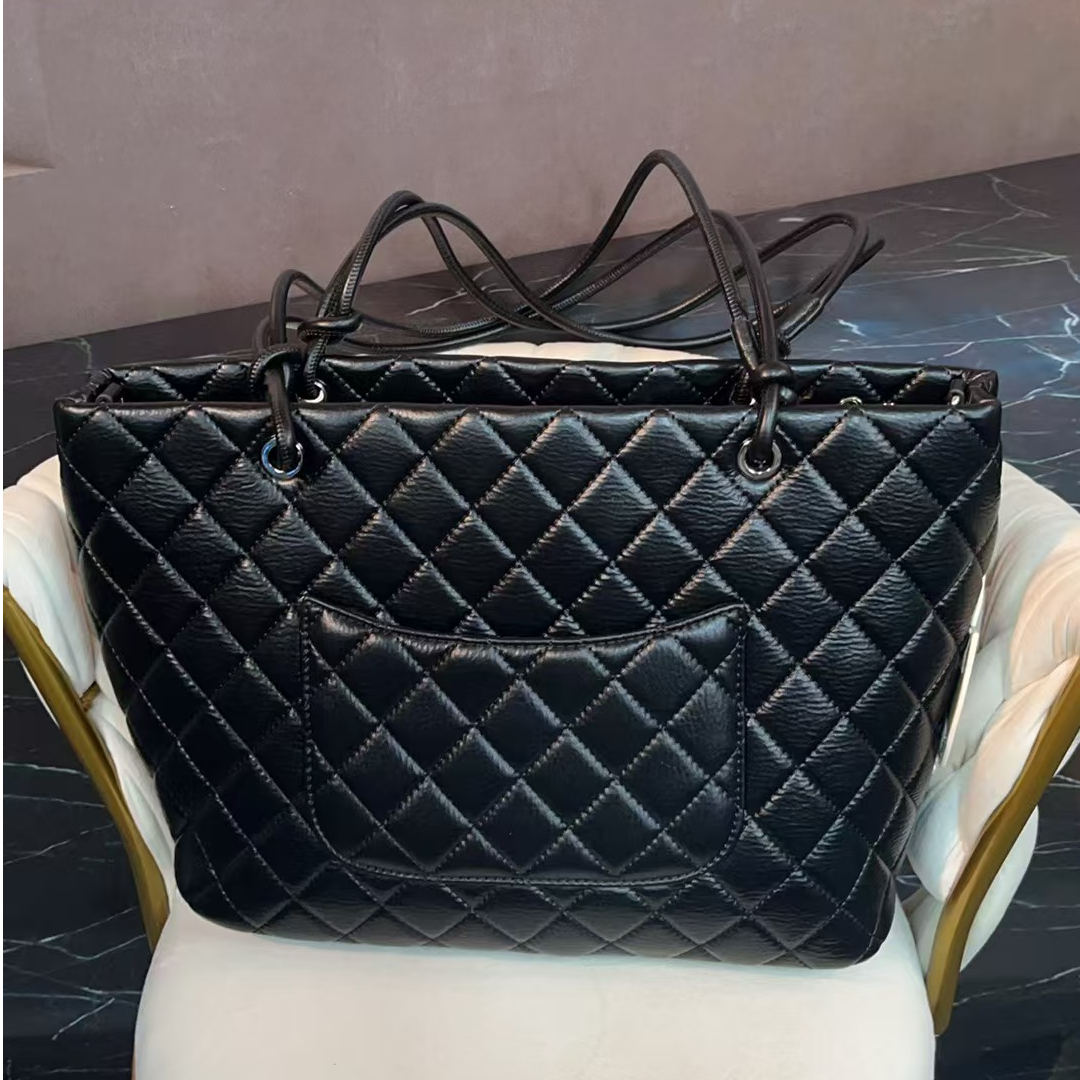 姝宴真皮女包菜篮子黑白色