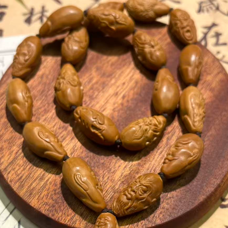 橄榄核雕刻怪脸罗汉长串文玩饰品