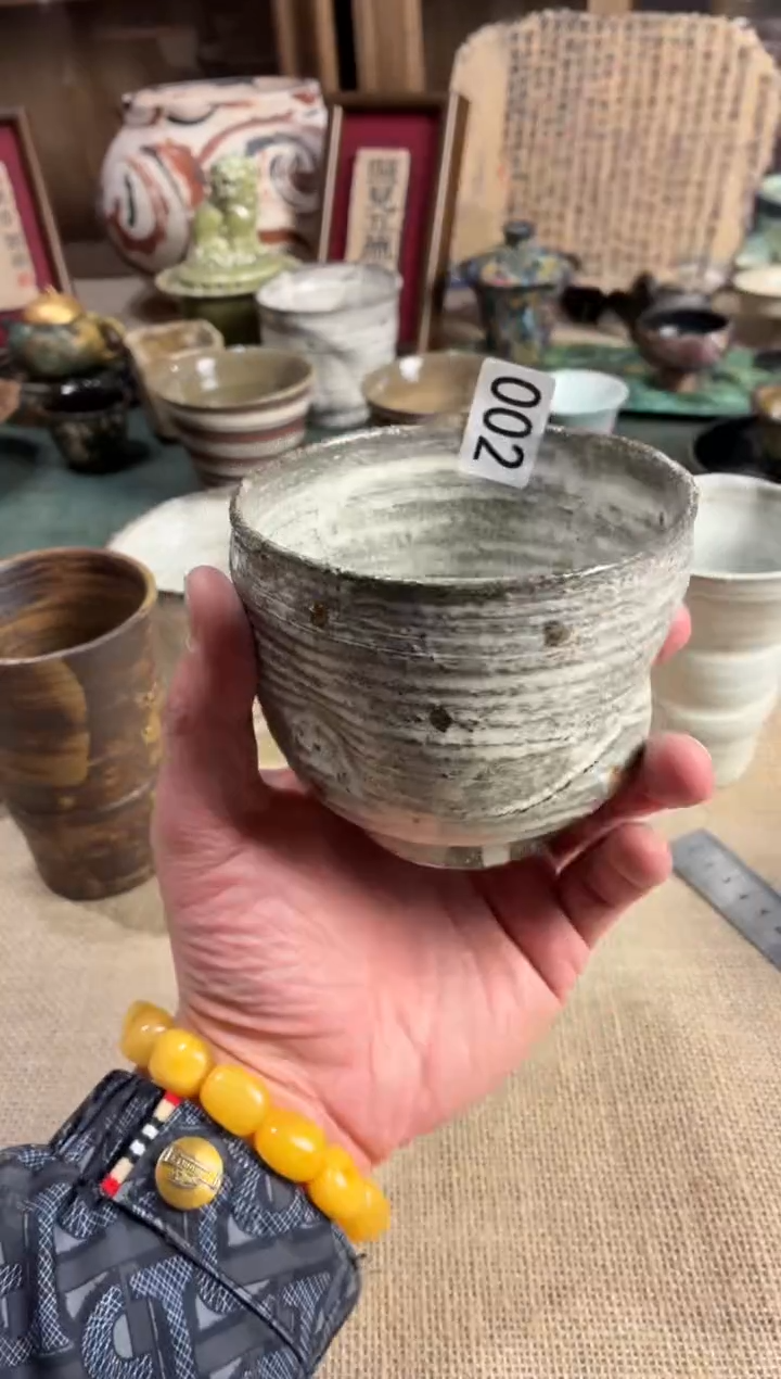 瓷片、****.002粉引定金手握杯1个