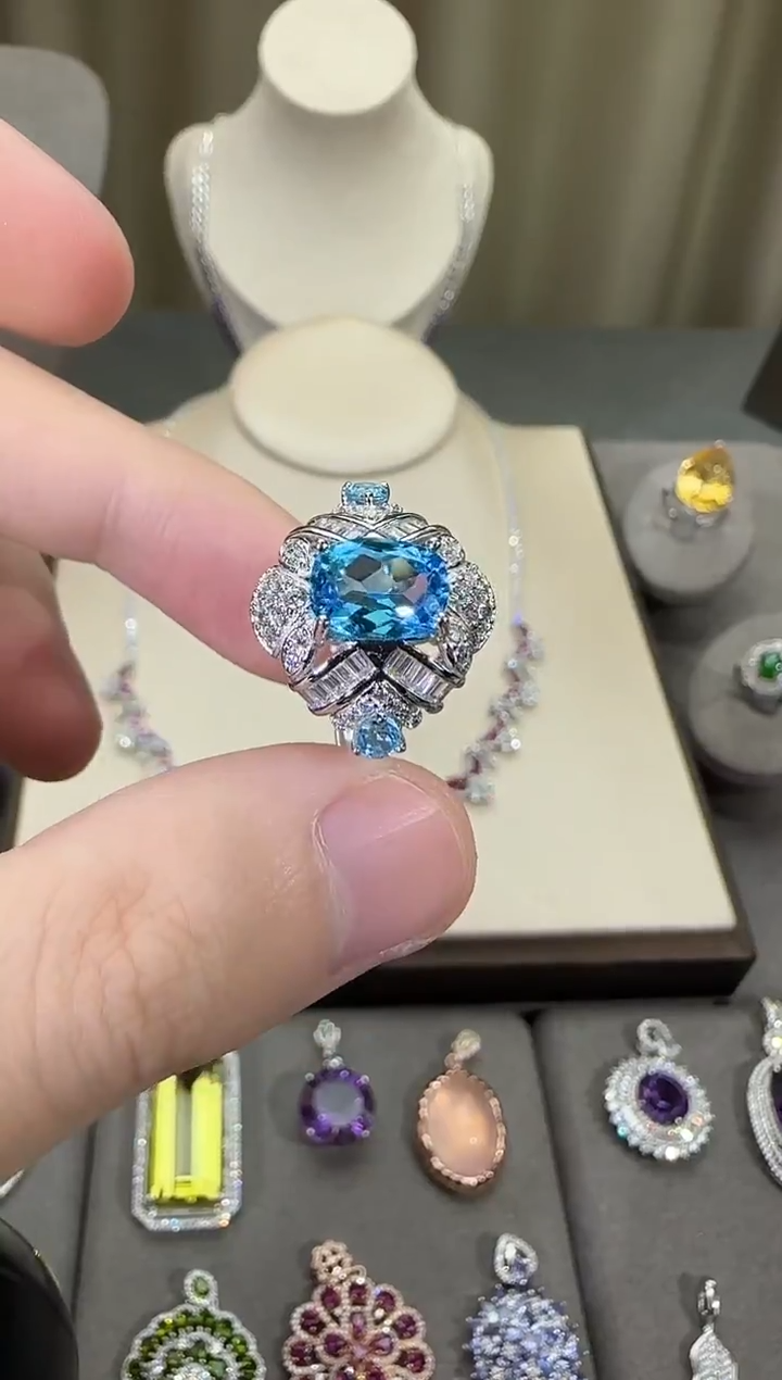 银S925镶嵌戒指托帕石10*8mm妖姬蓝设计款