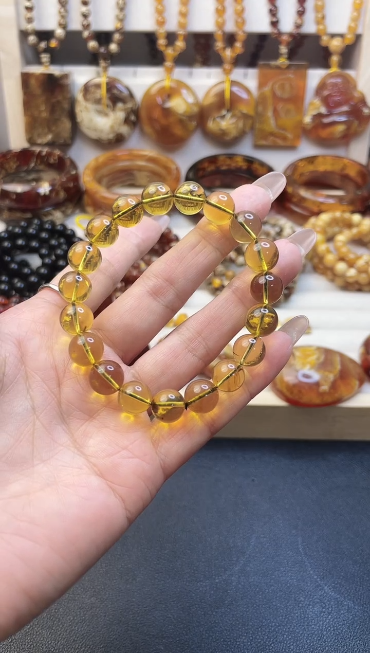 贝壳非金属Q****狼蓝 珀 卡 10 手 串