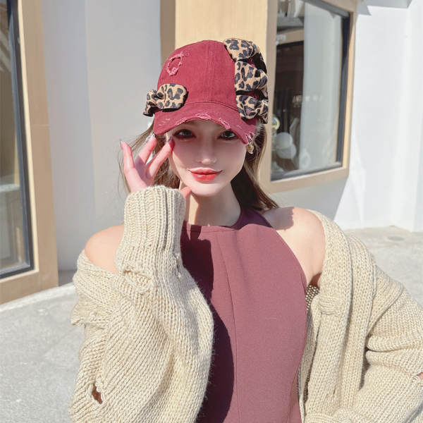 NIUYANG 设计师款不规则帽檐豹纹蝴蝶结球帽琉璃爱心吊坠鸭舌帽