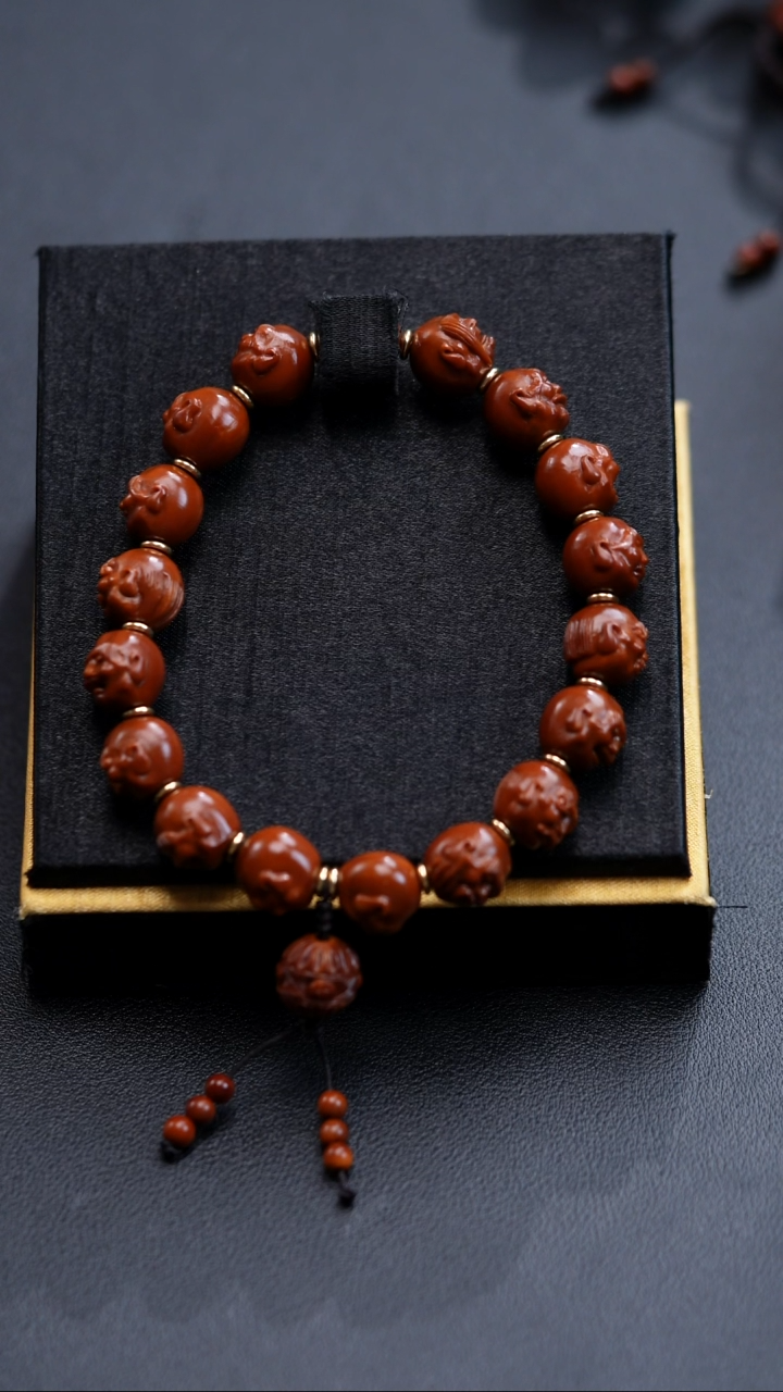 手串橄榄核石****司罗汉头12*12