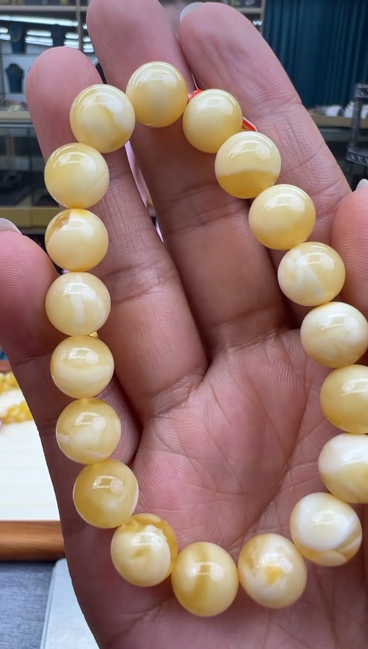 未镶嵌琥珀手链27秒拍号假一罚十